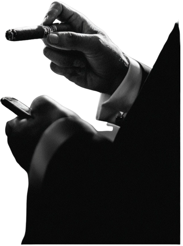 Man holding cigar and phone
